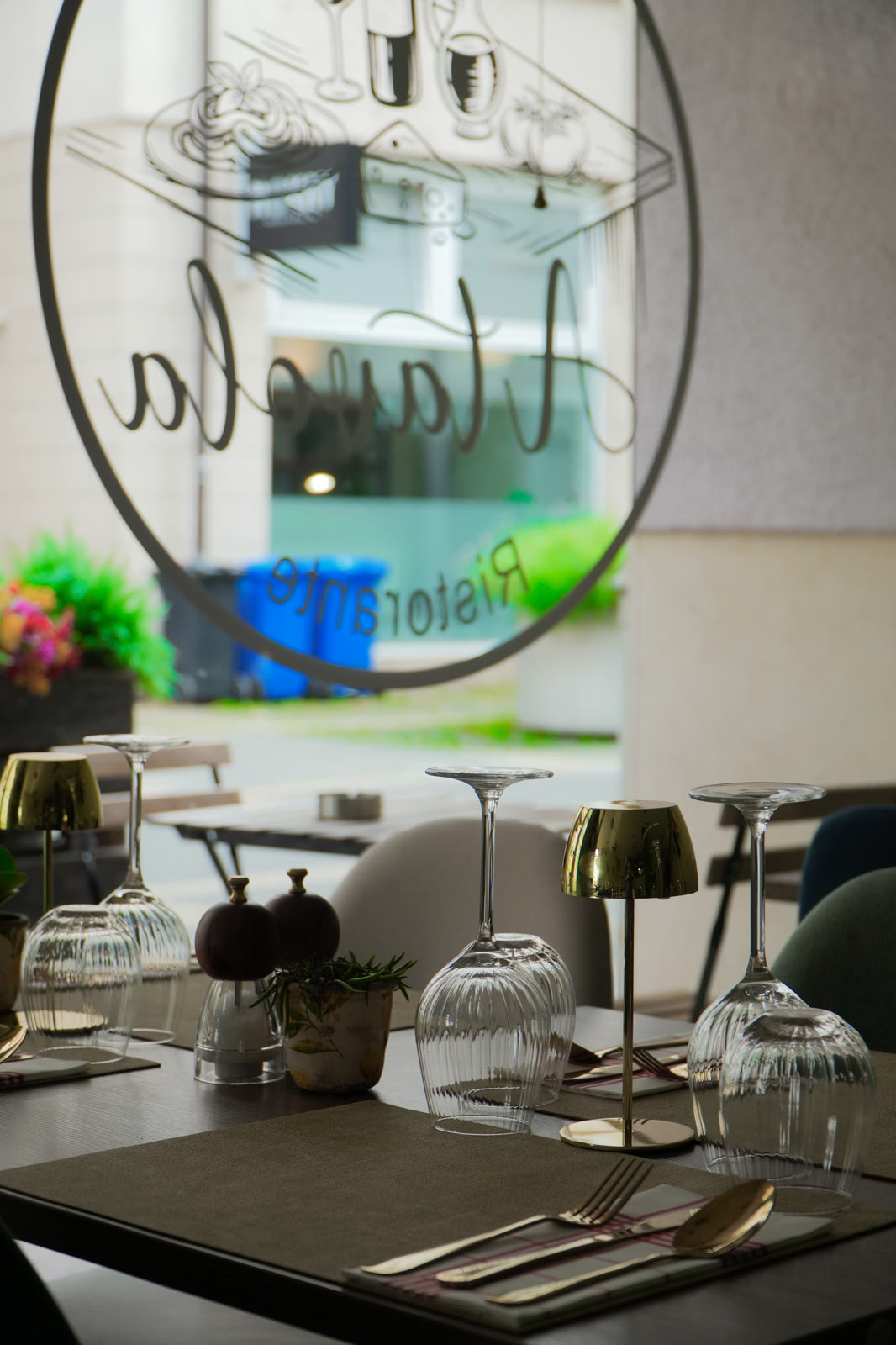 A Tavola Ristorante logo on the window and the set dining room