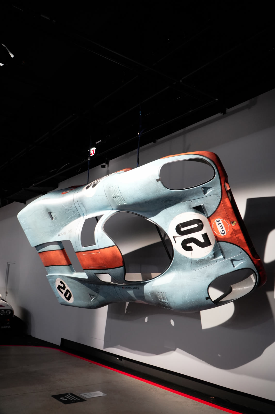 Gulf-livery Porsche 917 mounted on the wall, Galleria 610
